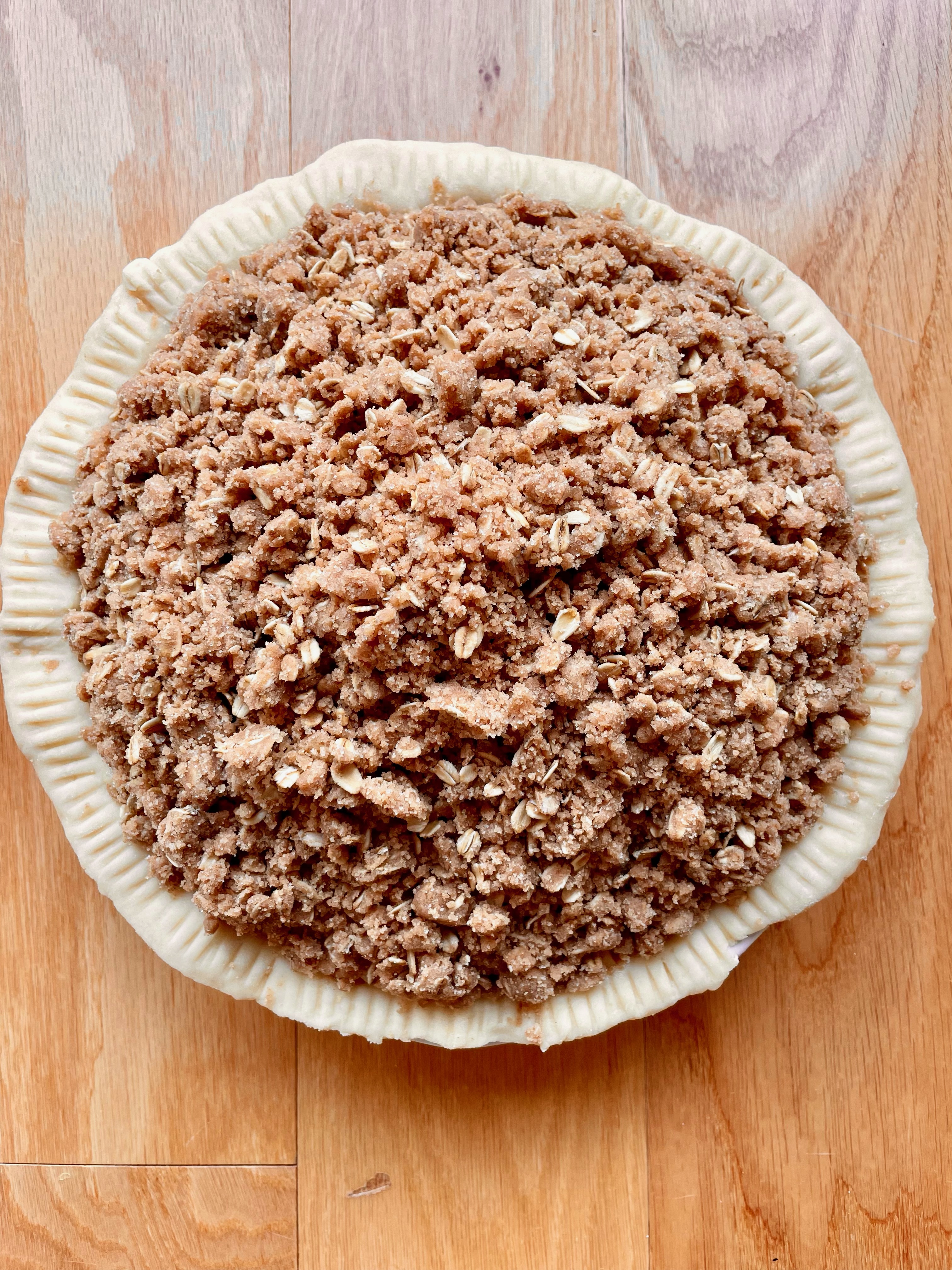 Unbaked Dutch apple pie with a crumb topping and traditional bottom pie crust