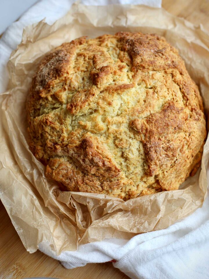 A loaf of Irish Soda Bread on a cutting board.