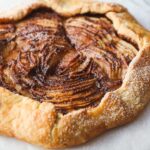 An Apple Crostata with apples arranged in an elegant presentation.