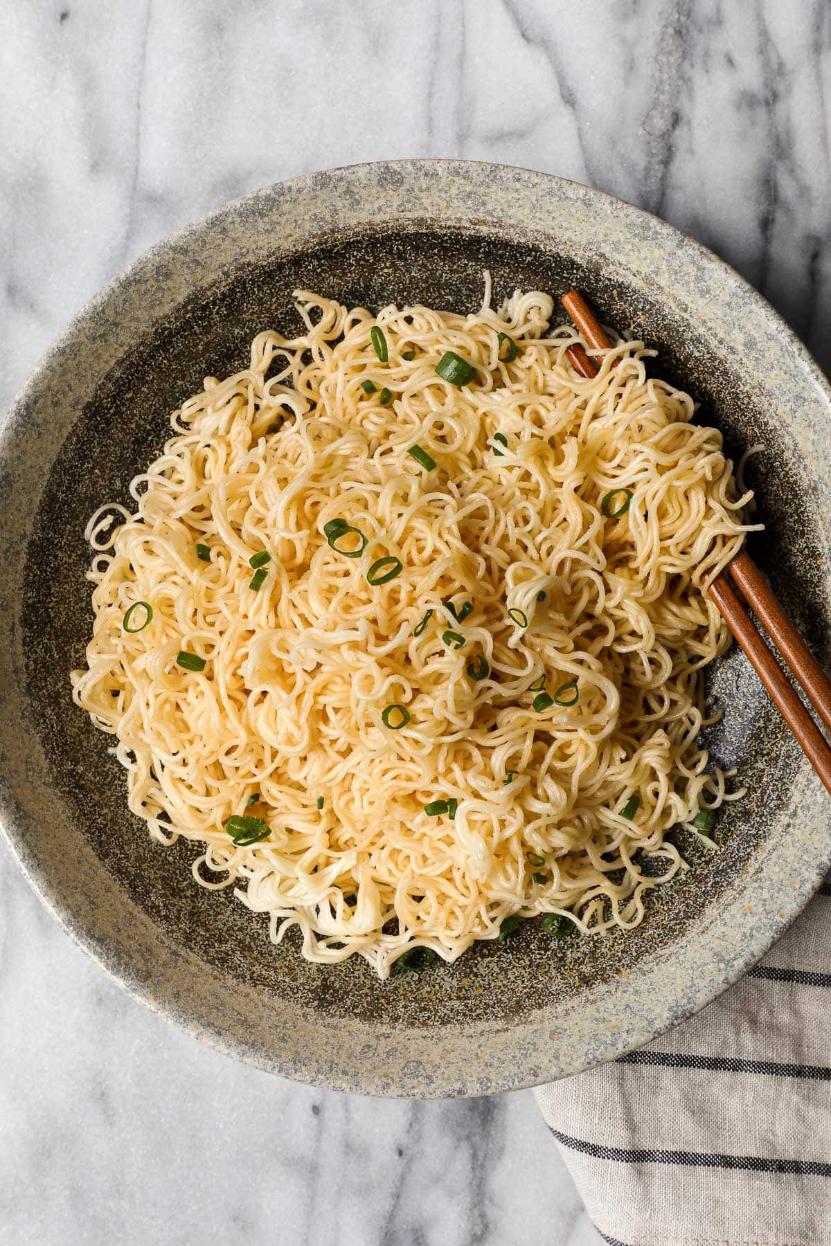 A bowl of Miso Butter Noodles with chopsticks.