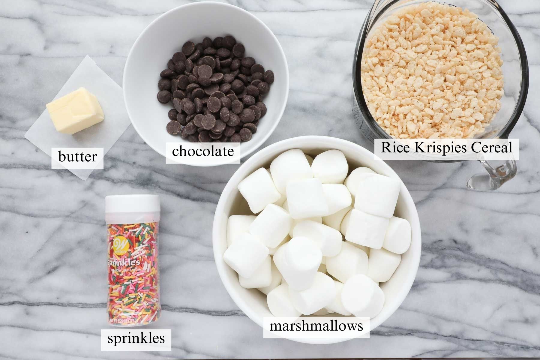 Ingredients needed to make chocolate dipped rice Krispie treats.