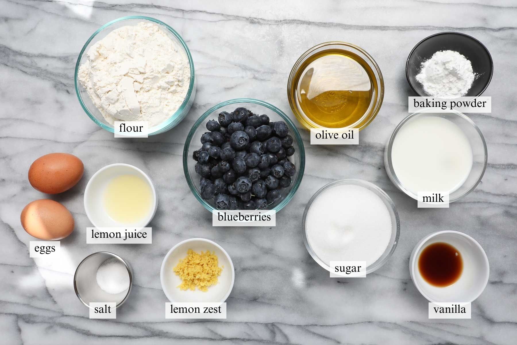 The ingredients needed to make Lemon Blueberry Olive Oil Cake.