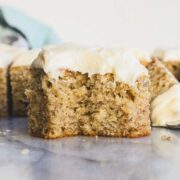 Banana Bread cut into a square and frosted with Banana Bread Frosting.