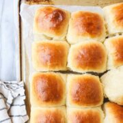Pull Apart Dinner Rolls arranged on a gold baking sheet.