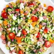 Protein Pasta Salad on a white serving plate with white ceramic handles.