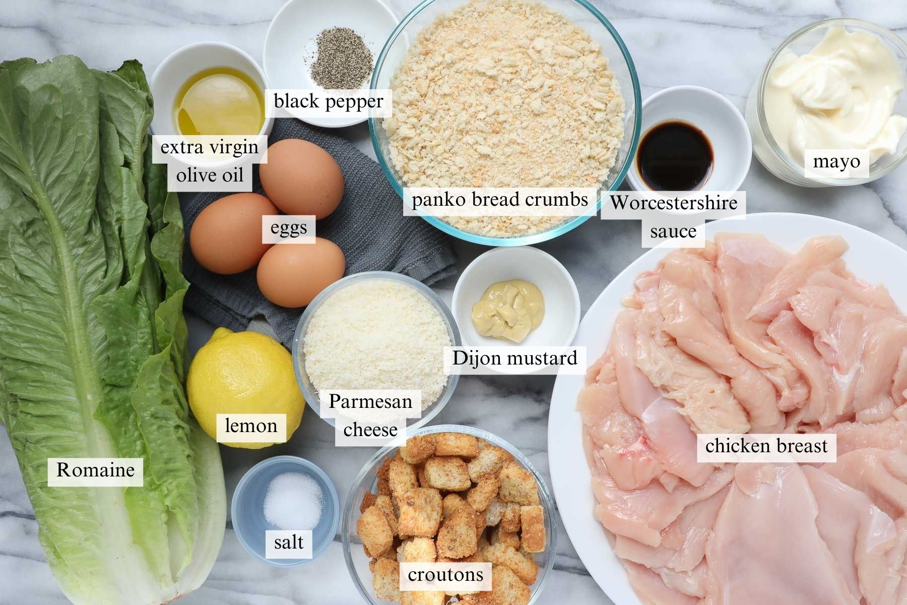 The ingredients needed to make Caesar Salad with Crispy Chicken.