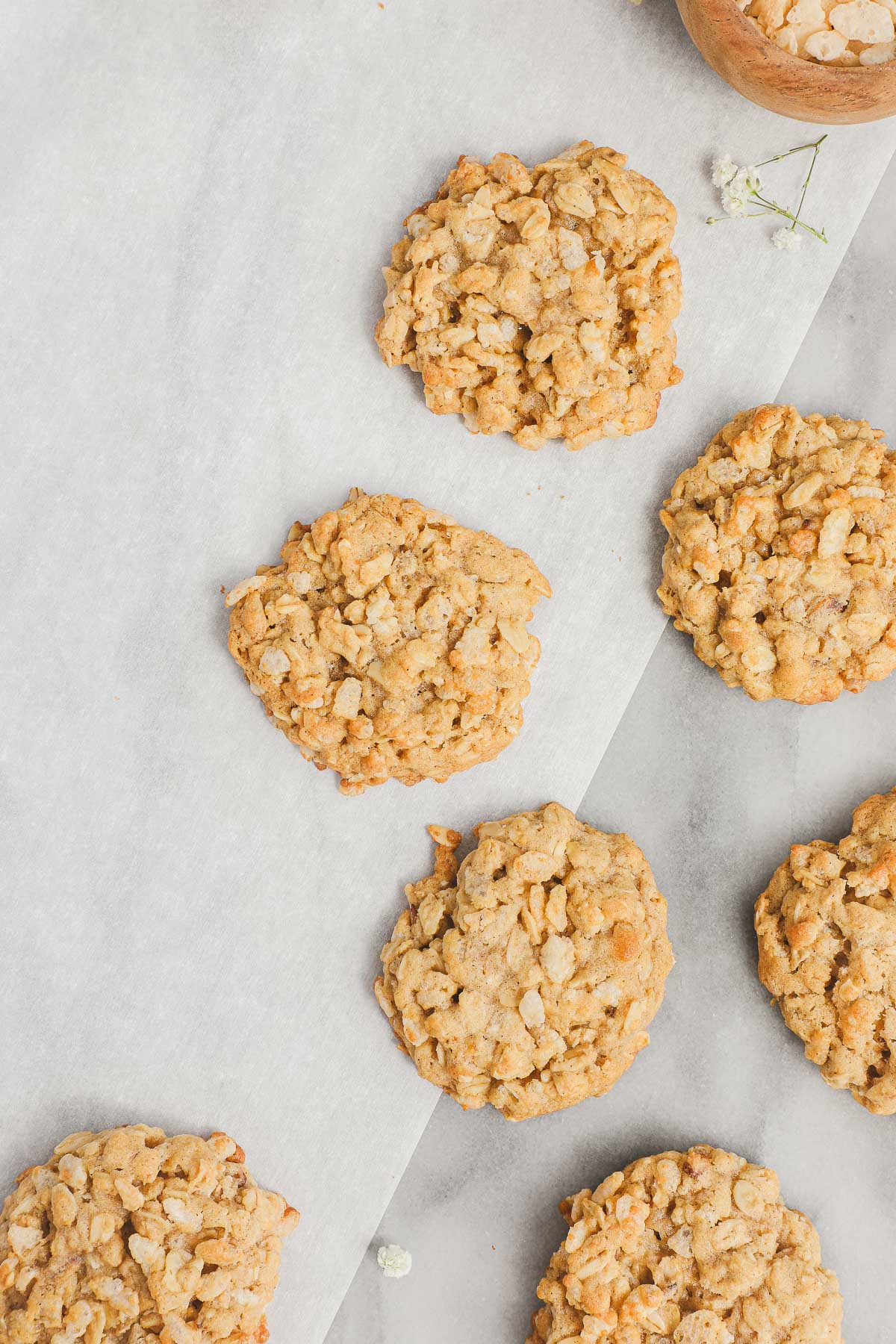 Oatmeal Rice Krispie Cookies arranged on a flat white and marble background.