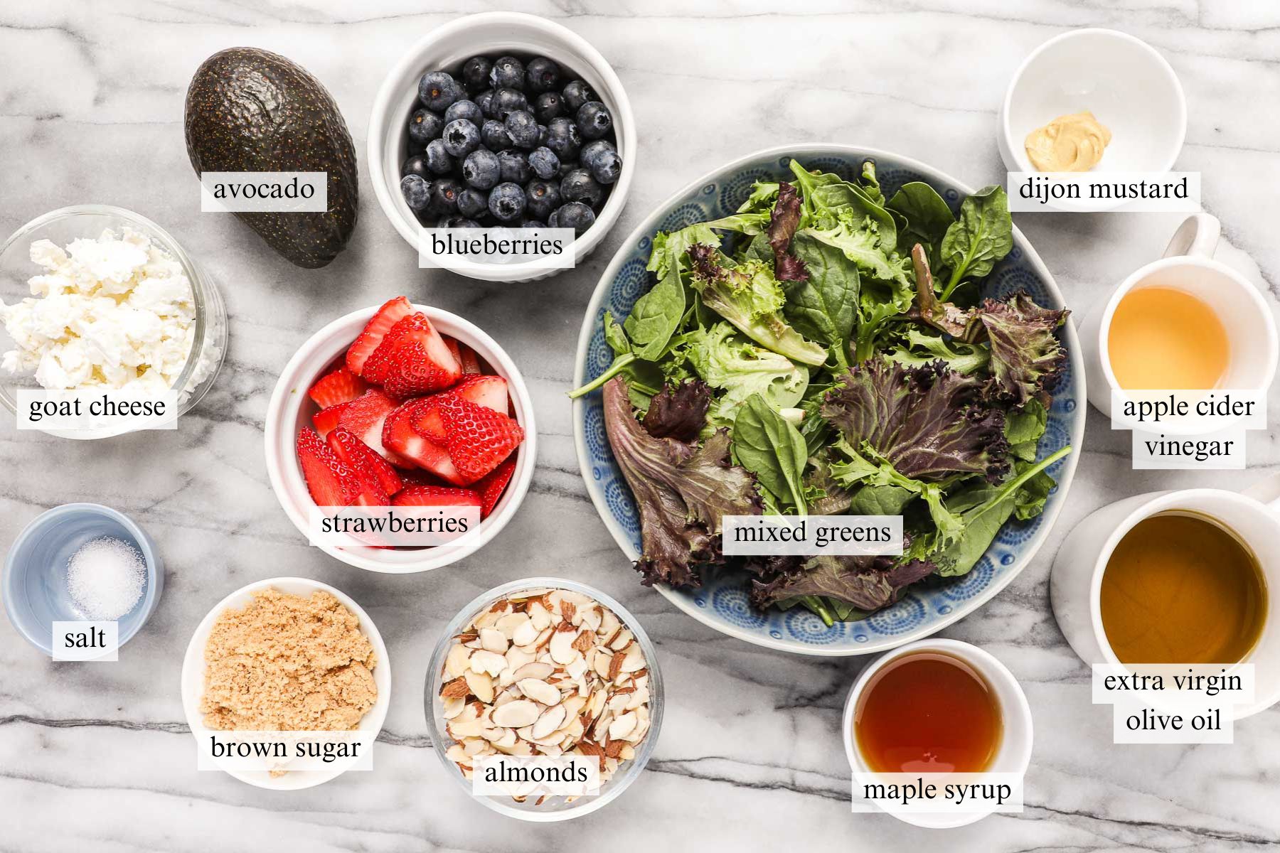 The ingredients needed to make Strawberry and Blueberry Salad with a Maple Vinaigrette.