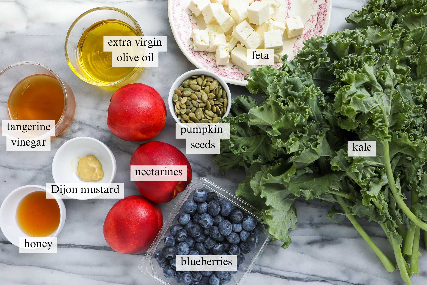 The ingredients needed to make Summer Kale Salad.